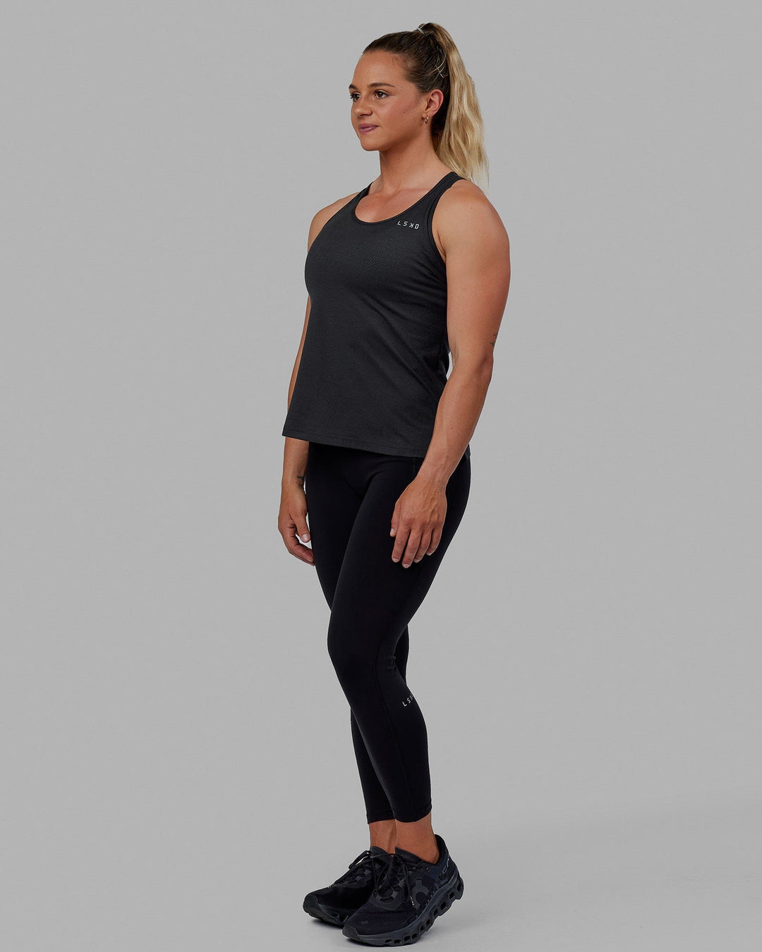 Woman wearing Perform VapourFLX Tank - Black Marl