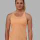Woman wearing Perform VapourFLX Tank - Tangerine Marl