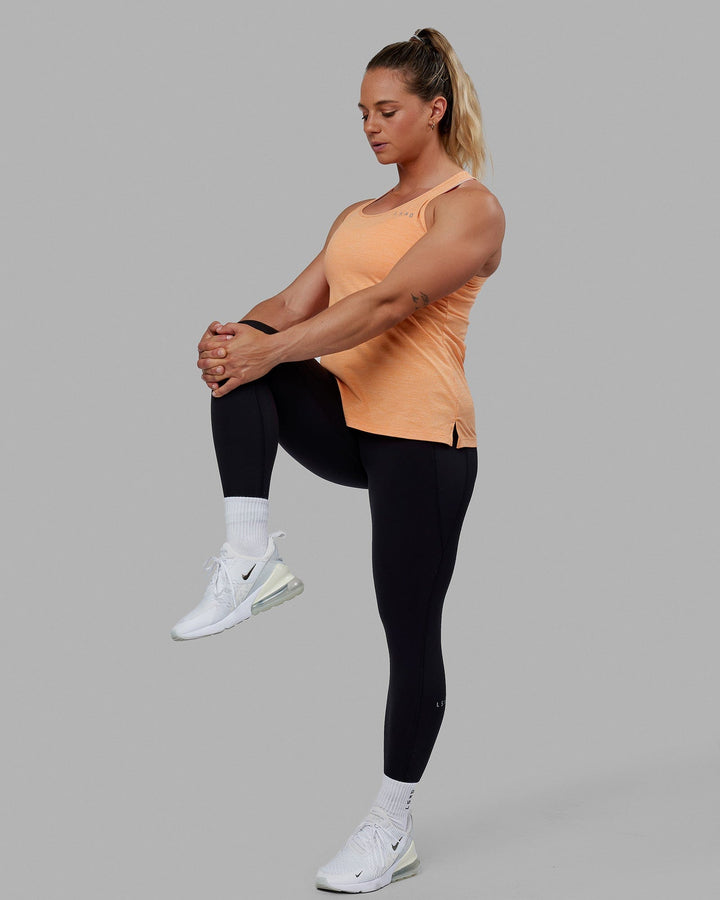 Woman wearing Perform VapourFLX Tank - Tangerine Marl