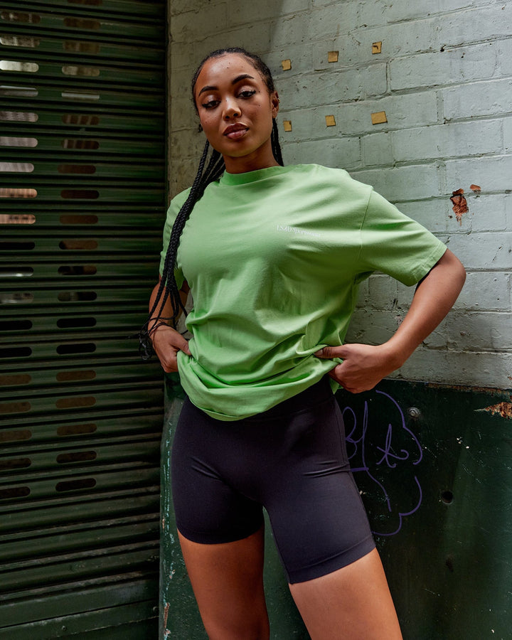 Woman wearing Unisex Motion FLXCotton Tee Oversize - Apple Mint