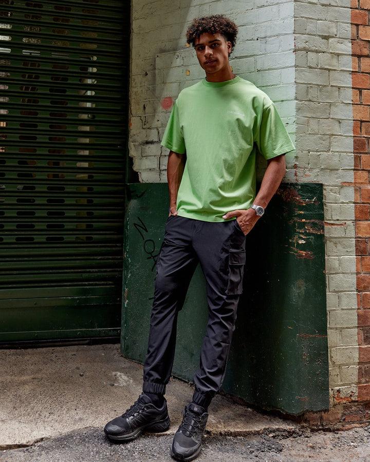 Man wearing Unisex Motion FLXCotton Tee Oversize - Apple Mint