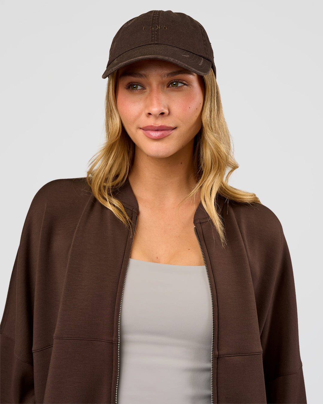 Woman wearing CF Move Through Cap - Hot Chocolate | Model:Leilani | Size:OS
