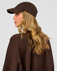 Woman wearing CF Move Through Cap - Hot Chocolate | Model:Leilani | Size:OS