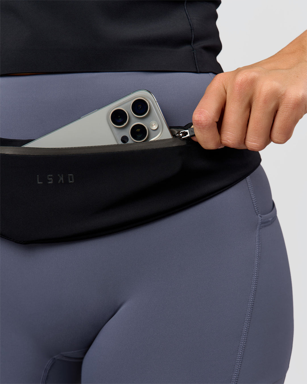 Woman wearing Pace Run Belt - Black-Reflective - view 2