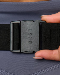 Woman wearing Pace Run Belt - Black-Reflective | Thumbnail Index: 2