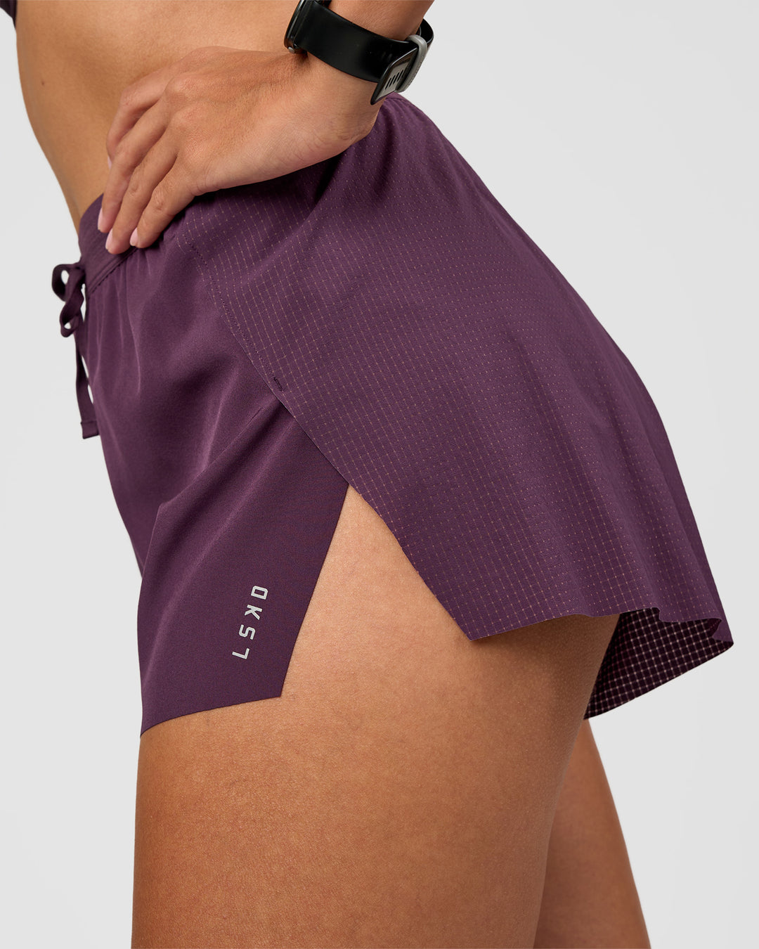 Woman wearing Accelerate 3" High-Rise Running Short - Midnight Plum | Model:Rhiley | Size:S