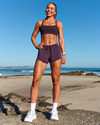 Woman wearing Accelerate 3" Mid-Rise Running Short - Midnight Plum | Model:Roisin | Size:S