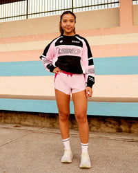 Woman wearing Accelerate 3" Mid-Rise Running Short - Scarlet-Marshmallow | Model:Clare | Size:S