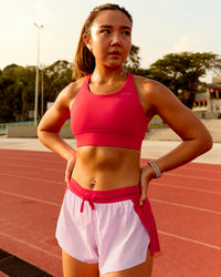 Woman wearing Accelerate 3" Mid-Rise Running Short - Scarlet-Marshmallow | Model:Clare | Size:S