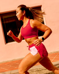 Woman wearing Accelerate 3" Mid-Rise Running Short - Scarlet-Marshmallow | Model:Clare | Size:S