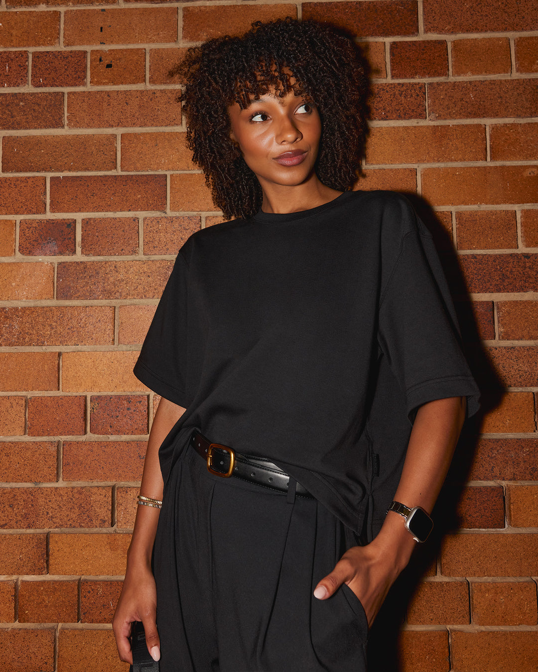 Woman wearing AfterDark ZeroCrease Cropped Tee - Black | Model:Tomi | Size:S