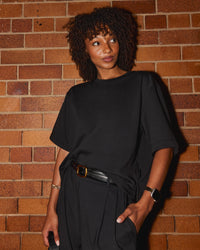 Woman wearing AfterDark ZeroCrease Cropped Tee - Black | Model:Tomi | Size:S