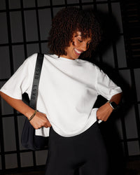 Woman wearing AfterDark ZeroCrease Cropped Tee - White | Model:Tomi | Size:S