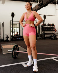 Woman wearing Agile Sports Bra - Pink Lemonade | Model:Charlotte | Size:S
