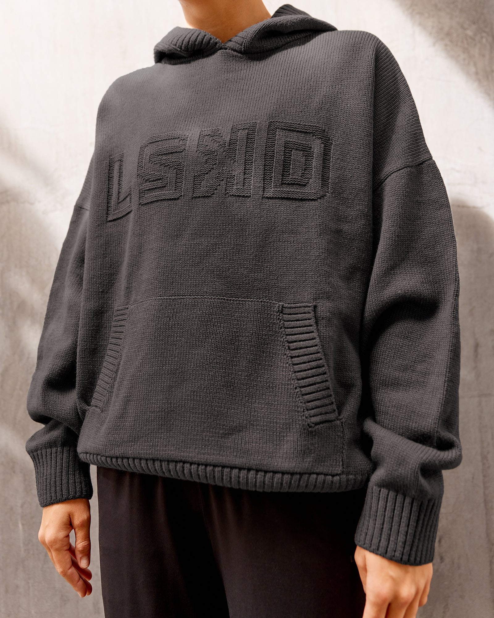 Woman wearing All Day Active Knitted Hoodie - Dark Storm | Size:S