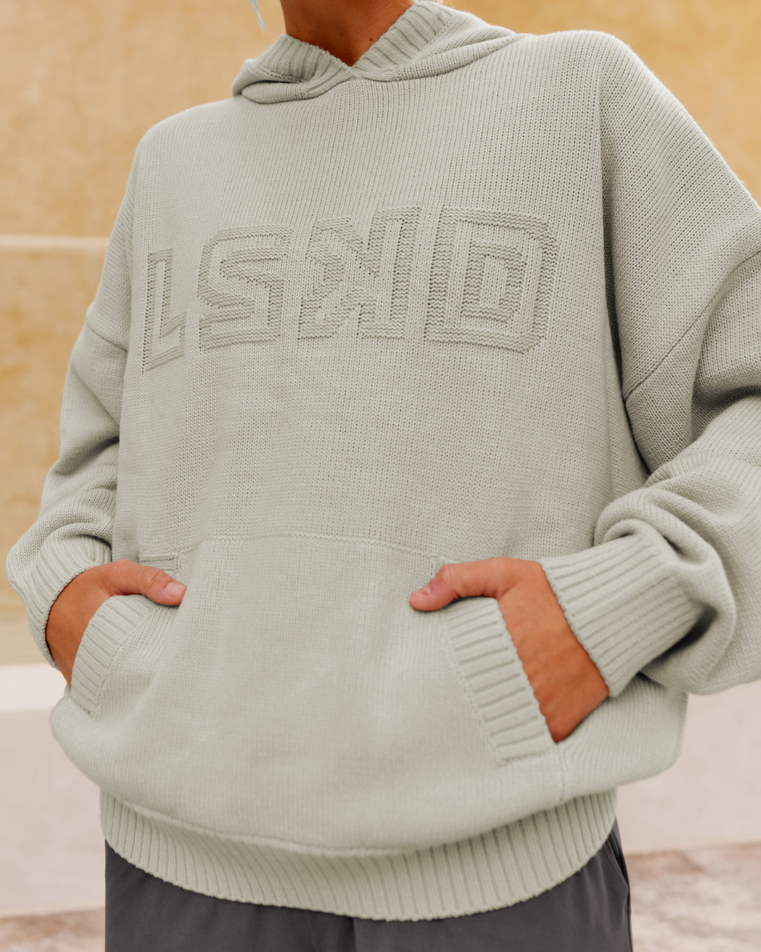 Woman wearing All Day Active Knitted Hoodie - Shale Beige | Size:S