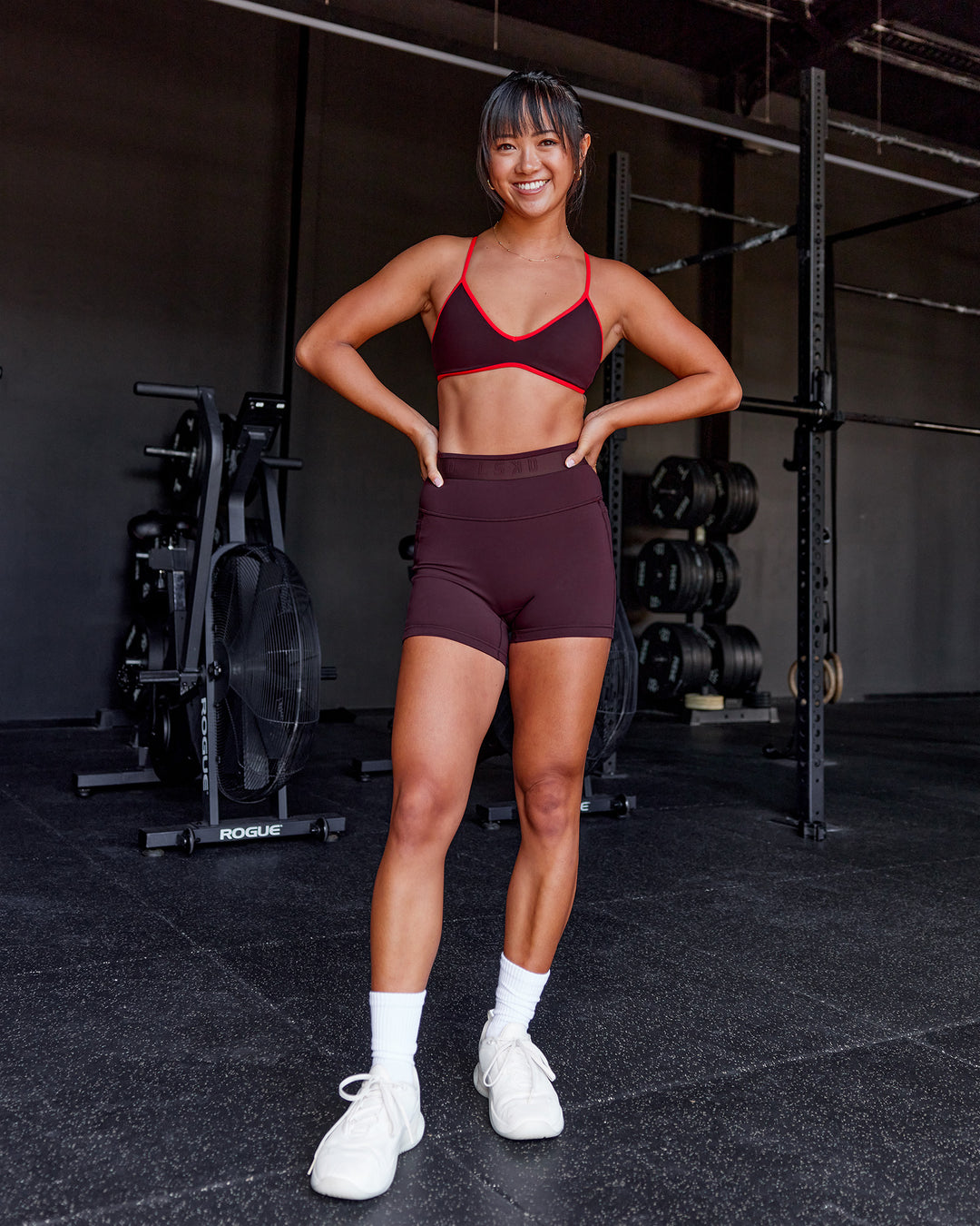 Woman wearing Ambience Sports Bra - Cherry Lacquer-Flame | Model:Iris | Size:S