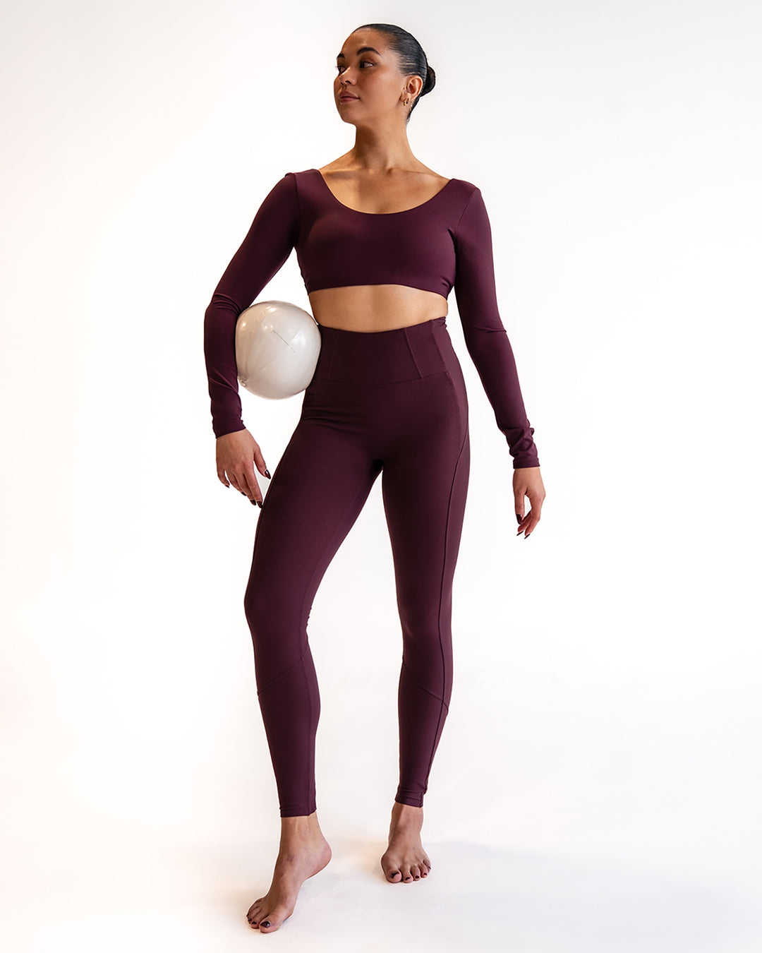 Woman wearing Aria Long Sleeve Sports Bra - Cherry Lacquer | Model:Sarah | Size:S
