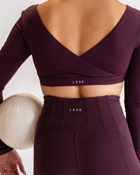 Woman wearing Aria Long Sleeve Sports Bra - Cherry Lacquer | Model:Sarah | Size:S