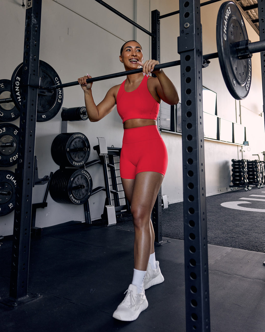 Woman wearing Ascent Sports Bra - Scarlet | Model:Keisha | Size:S