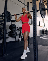 Woman wearing Ascent Sports Bra - Scarlet | Model:Keisha | Size:S