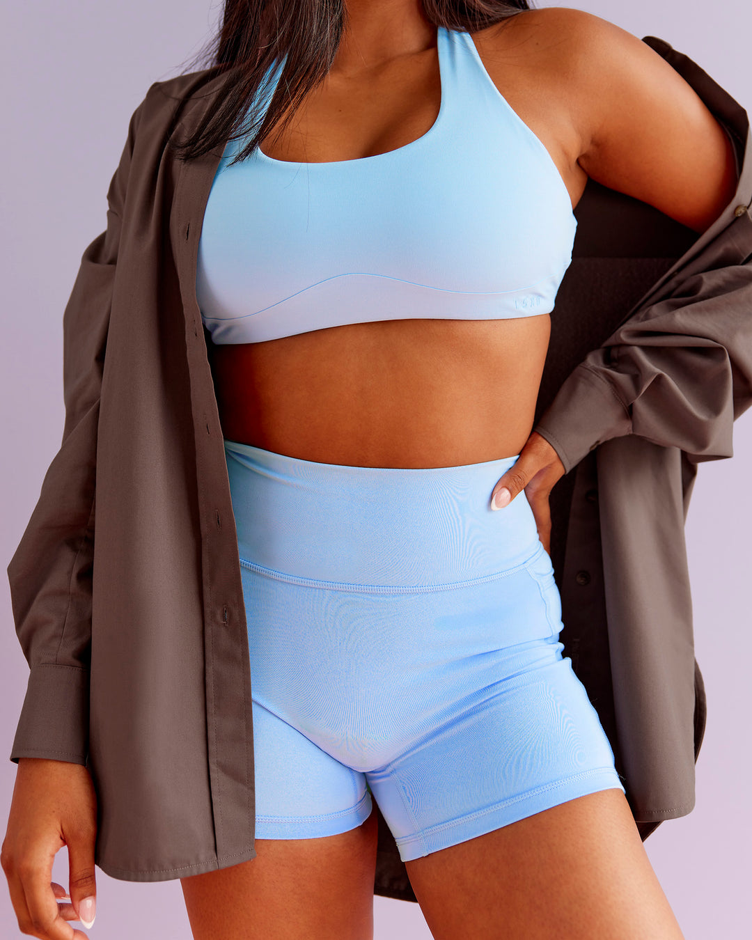 Woman wearing Aspire Sports Bra - Open Air | Model:Nikki | Size:S