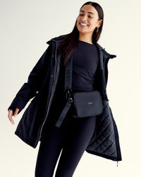 Woman wearing Auxiliary 2.0 Jacket - Black | Model:Ruby | Size:S