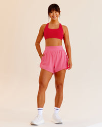 Woman wearing Challenger 3" Lined Performance Shorts in Pink Lemonade | Size:S
