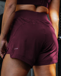 Woman wearing Challenger 5" Lined Performance Short - Cherry Lacquer | Model:Sammy | Size:S