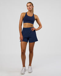 Woman wearing Challenger 5" Lined Performance Short - Future Navy | Model: Evie | Size:S