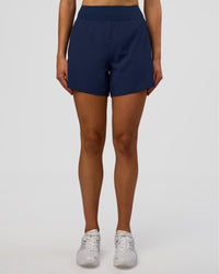 Woman wearing Challenger 5" Lined Performance Short - Future Navy | Model: Evie | Size:S