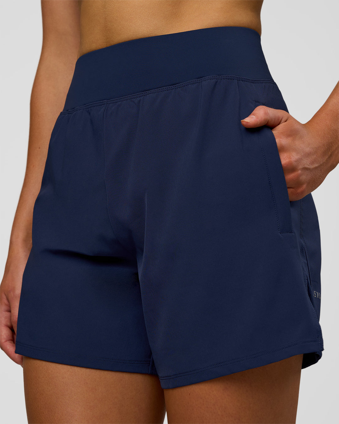 Woman wearing Challenger 5" Lined Performance Short - Future Navy | Model: Evie | Size:S