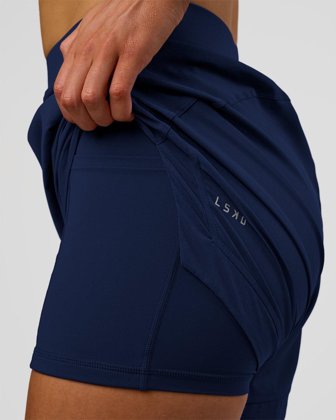 Woman wearing Challenger 5" Lined Performance Short - Future Navy | Model: Evie | Size:S