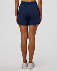 Woman wearing Challenger 5" Lined Performance Short - Future Navy | Model: Evie | Size:S