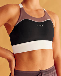 Woman wearing Elevated Accelerate Sports Bra - Black-Multi | Model:Charlize | Size:S