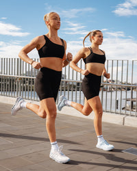 Duo wearing Elite Run High-Rise 7" Short Pockets - Black | Model:Both | Size:S