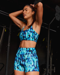 Woman wearing Elixir Ultra High-Rise 4" Short Pockets - Luminous | Model:Rhiley | Size:S