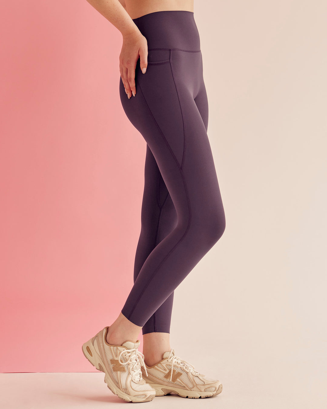 Woman wearing Elixir Ultra High-Rise 7/8 Legging Pockets - Midnight Plum | Model:Paradise | Size:S