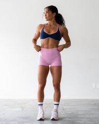 Woman wearing Enhance Ultra High-Rise 4" Short - Pink Frosting | Model:Emily | Size:S