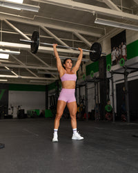 Woman wearing Enhance Ultra High-Rise 4" Short - Pink Frosting | Model:Emily | Size:S