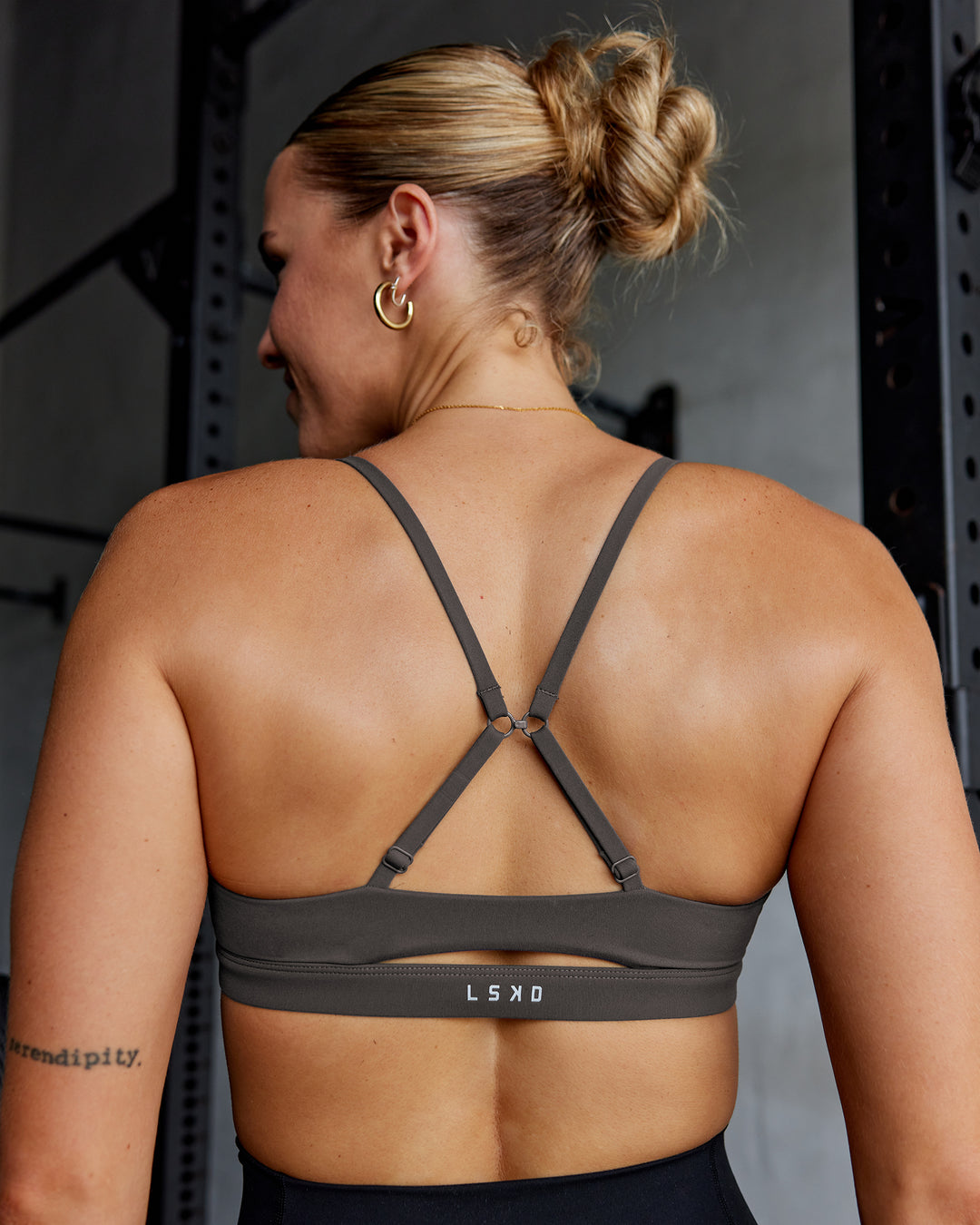Woman wearing Essence Sports Bra - Dark Storm | Model:Shae | Size:S