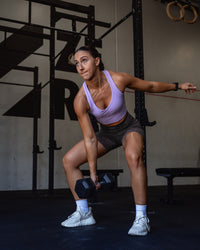 Woman wearing Evoke Longline Sports Bra - Violet Ray | Model:Summer | Size:S