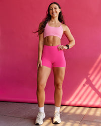 Woman wearing Fusion Ultra High-Rise 4" Short Pockets - Ultra Pink | Model:Summer | Size:S