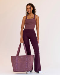 Woman wearing Fusion V-Contour High-Rise Flared Legging Pockets - Cherry Lacquer | Model:Jordan | Size:S