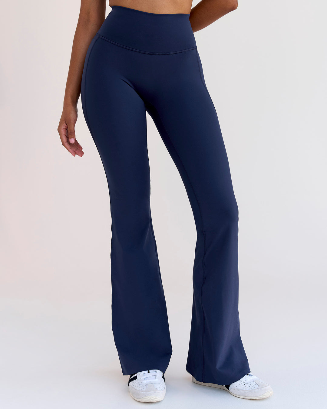Woman wearing Fusion V-Contour High-Rise Flared Legging Pockets - Future Navy | Model:Jordan | Size:S