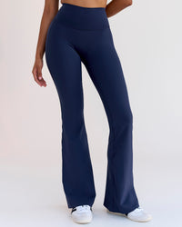 Woman wearing Fusion V-Contour High-Rise Flared Legging Pockets - Future Navy | Model:Jordan | Size:S