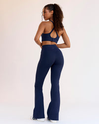 Woman wearing Fusion V-Contour High-Rise Flared Legging Pockets - Future Navy | Model:Jordan | Size:S