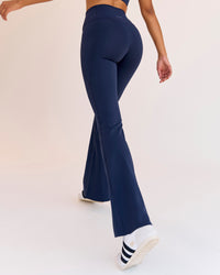 Woman wearing Fusion V-Contour High-Rise Flared Legging Pockets - Future Navy | Model:Jordan | Size:S