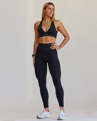 Woman wearing Fusion V-Contour Ultra High-Rise Full Length Legging Pockets - Black | Model:Shae | Size:S