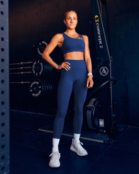 Woman wearing Galvanise Sports Bra 2.0 - Midnight Blue | Model:Dani | Size:S